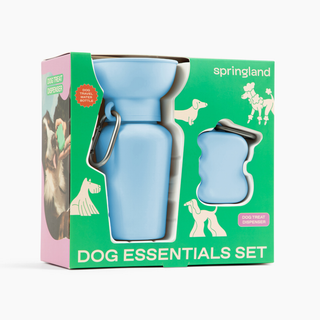Springland Dog Essentials Set box featuring sky blue water bottle and treat dispenser, angled side view