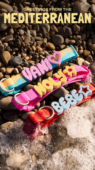 Greetings from the Mediterranean - charm collars on a pebble beach