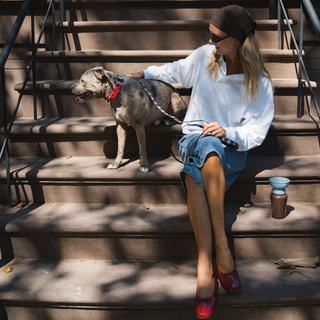 Sitting on the stoop with dog in the personalized collar Saddle